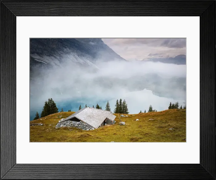 Framed Print : Hut on mountain ridge above lake Oeschinensee covered by mist, Bernese Oberland Framed Print : Hut on mountain ridge above lake Oeschinensee covered by mist, Bernese Oberland