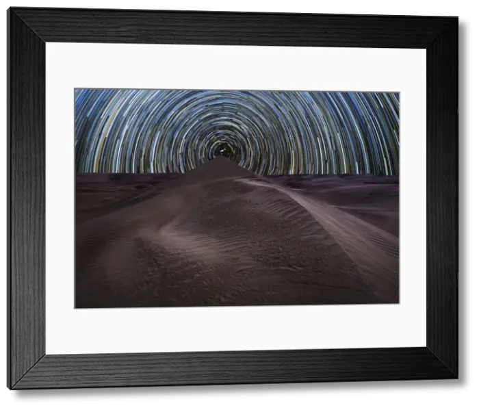 Framed Print : Concentric circumpolar star trail above sand dunes in the Rub al Khali desert, Oman Framed Print : Concentric circumpolar star trail above sand dunes in the Rub al Khali desert, Oman