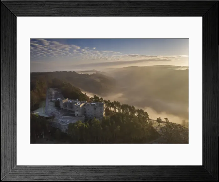 Framed Print : Aerial vista of Castle Drogo and the Teign Valley in morning mist in winter, Dartmoor Framed Print : Aerial vista of Castle Drogo and the Teign Valley in morning mist in winter, Dartmoor