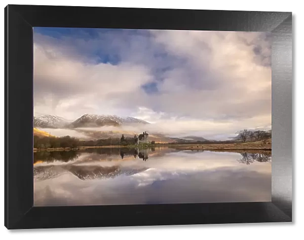 Kilchurn Castle reflected in Loch Awe at dawn in winter, Highlands, Scotland