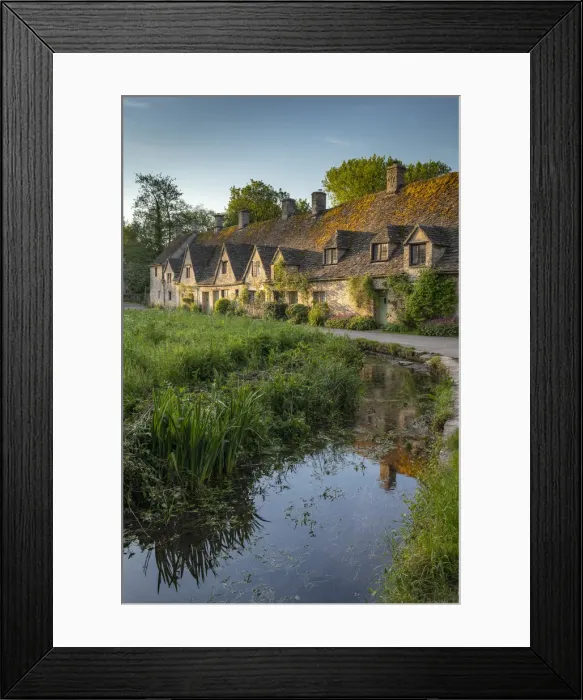 Framed Print : Early Spring morning view of the beautiful Cotswolds cottages at Arlington Row in Bibury Framed Print : Early Spring morning view of the beautiful Cotswolds cottages at Arlington Row in Bibury