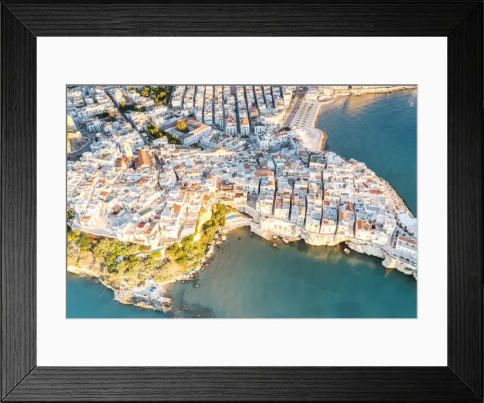 Framed Print : Aerial view of white buildings of Vieste by the crystal sea, Foggia province Framed Print : Aerial view of white buildings of Vieste by the crystal sea, Foggia province