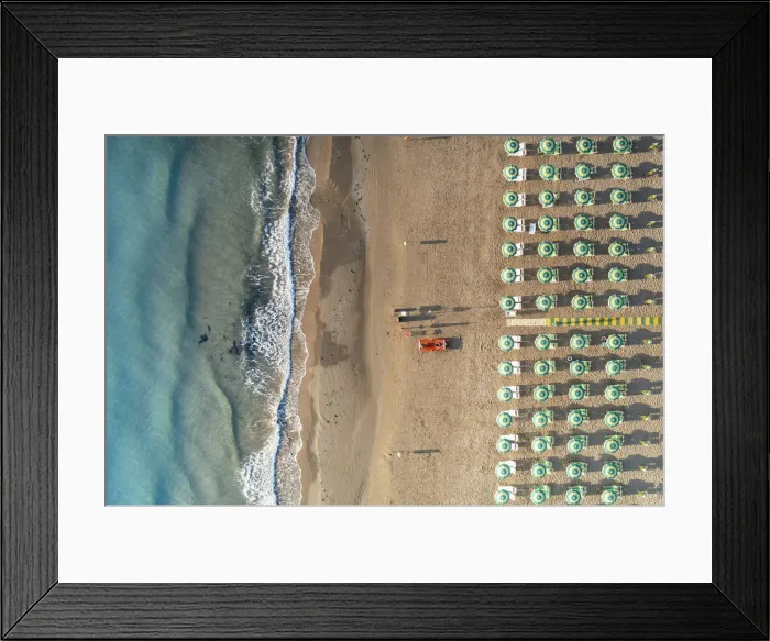 Framed Print : Aerial view of beach umbrellas and sunbeds in tidy rows during summer, Vieste Framed Print : Aerial view of beach umbrellas and sunbeds in tidy rows during summer, Vieste