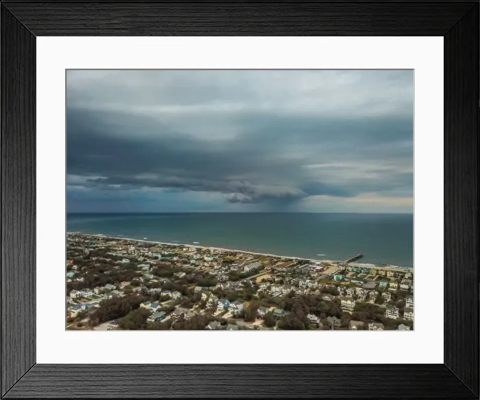 Framed Print : Rain squall moves across the Atlantic Ocean offshore of Nags Head, North Carolina