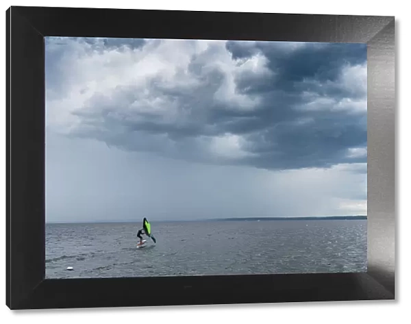 Skip Brown wind surfing into some weather on Sebago Lake, Maine, United States of America