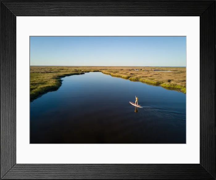 Framed Print : Stand up paddle boarder paddles through a Chesapeake Bay salt marsh near Hampton Framed Print : Stand up paddle boarder paddles through a Chesapeake Bay salt marsh near Hampton