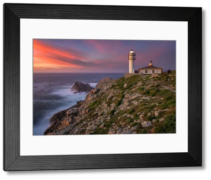 Framed Print : Sea landscape view of Cape Tourinan Lighthouse at sunset with pink clouds, Galicia, Spain Framed Print : Sea landscape view of Cape Tourinan Lighthouse at sunset with pink clouds, Galicia, Spain