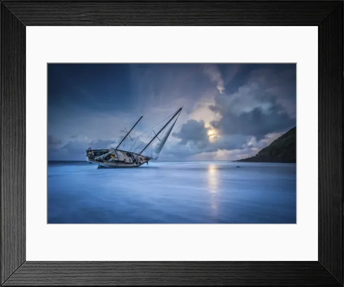Framed Print : An abandoned sailboat rests on its side at low tide in Moloa a Bay Framed Print : An abandoned sailboat rests on its side at low tide in Moloa a Bay