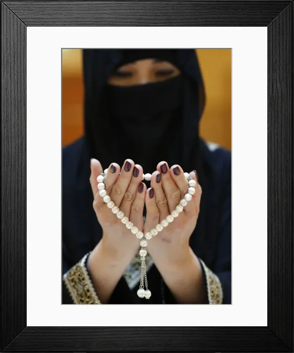 Framed Print : Close up of a Muslim womans hands in abaya while holding rosary and praying Framed Print : Close up of a Muslim womans hands in abaya while holding rosary and praying