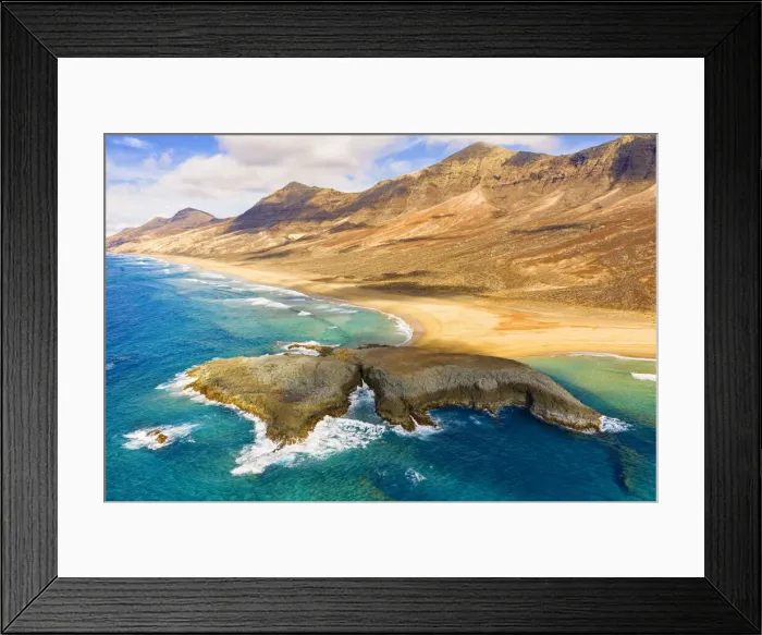 Framed Print : Aerial view of El Islote islet in the crystal ocean along Cofete beach, Jandia