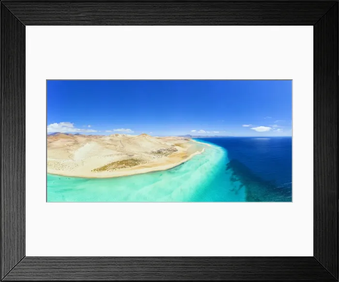 Framed Print : Aerial view of desert landscape of Jandia Nature Park washed by crystal sea, Costa Calma Framed Print : Aerial view of desert landscape of Jandia Nature Park washed by crystal sea, Costa Calma