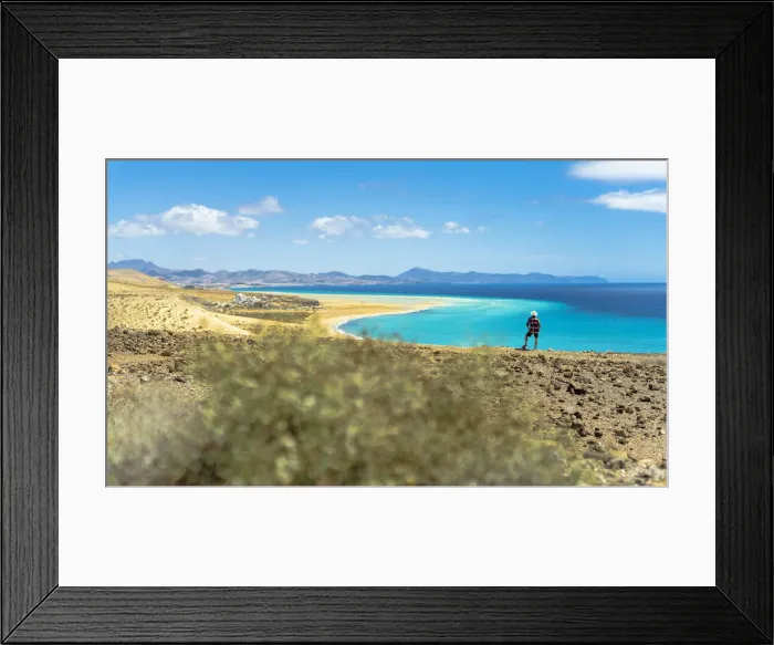Framed Print : Tourist with straw hat looking at the ocean from Mirador Del Salmo viewpoint, Costa Calma Framed Print : Tourist with straw hat looking at the ocean from Mirador Del Salmo viewpoint, Costa Calma