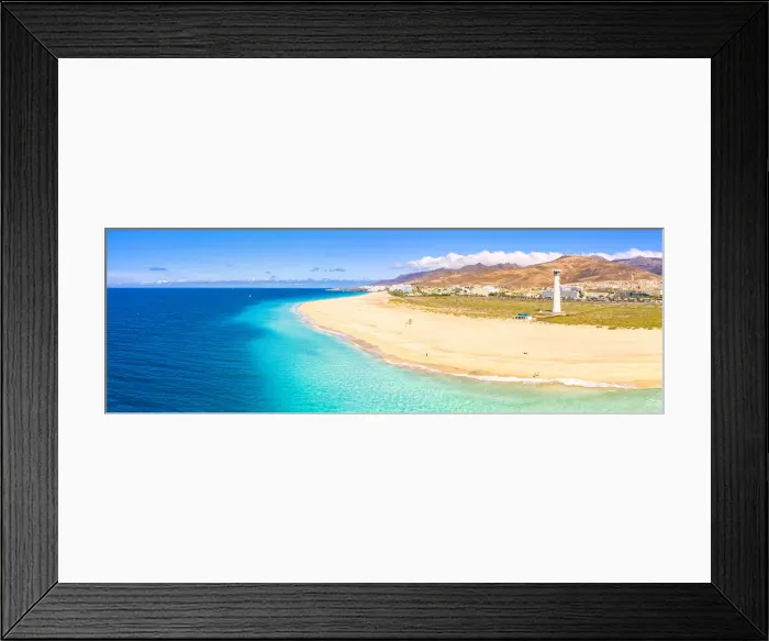 Framed Print : Aerial view of the white sand beach and lighthouse of Morro Jable, Fuerteventura Framed Print : Aerial view of the white sand beach and lighthouse of Morro Jable, Fuerteventura