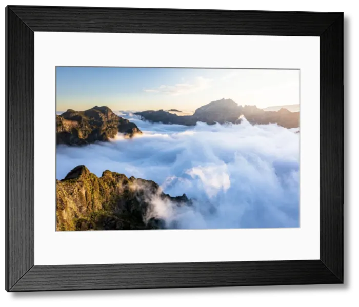 Framed Print : Mountain peaks emerging from clouds at sunset view from Pico Ruivo, Madeira, Portugal Framed Print : Mountain peaks emerging from clouds at sunset view from Pico Ruivo, Madeira, Portugal