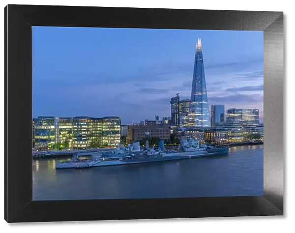 View of the Shard, HMS Belfast and River Thames from Cheval Three Quays at dusk, London