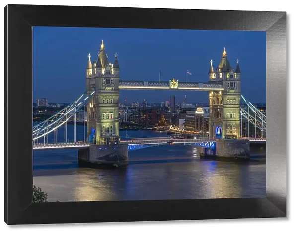 View of Tower Bridge from Cheval Three Quays at dusk, London, England, United Kingdom
