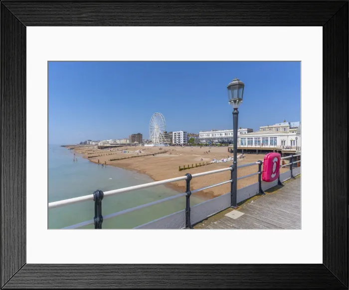 Framed Print : View of beach front houses and ferris wheel from the pier, Worthing, West Sussex, England