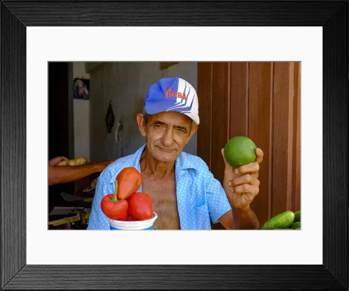 Framed Print : A man at a vegetable stand holds up a lime, Trinidad, Cuba, West Indies, Central America Framed Print : A man at a vegetable stand holds up a lime, Trinidad, Cuba, West Indies, Central America