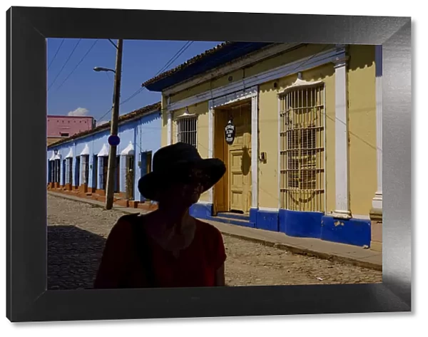 The silhouette of a woman on a quiet street, Trinidad, Sancti Spiritus, Cuba, West Indies