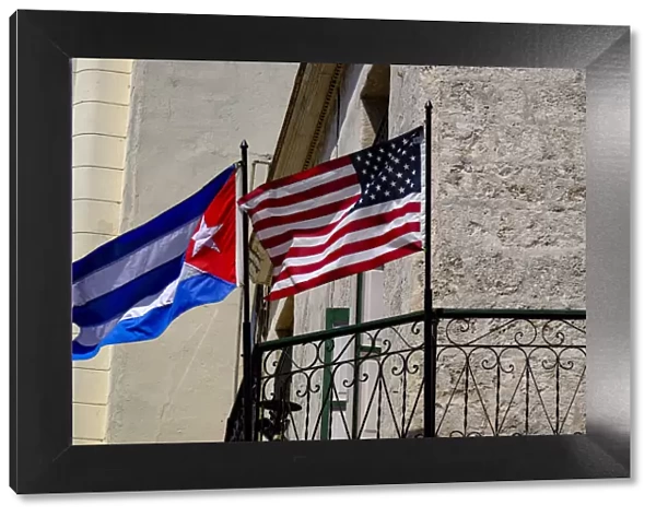 Cuban and American flags waving side by side, Old Havana, Cuba, West Indies