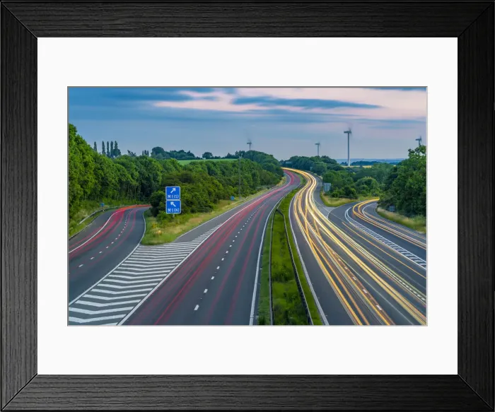 Framed Print : View of trail lights on the intersection of M1 and M18 Motorways at dusk in South Framed Print : View of trail lights on the intersection of M1 and M18 Motorways at dusk in South