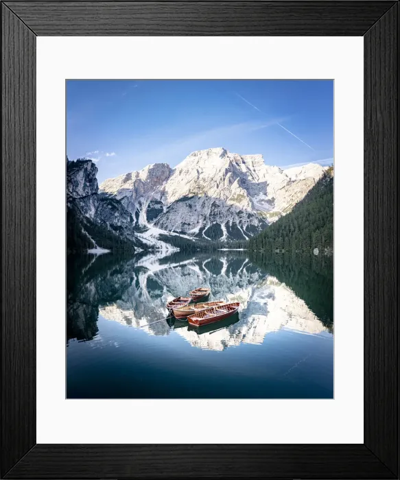 Framed Print : Boats moored in Lake Braies (Pragser Wildsee) with mountains reflected in water Framed Print : Boats moored in Lake Braies (Pragser Wildsee) with mountains reflected in water