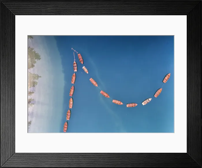 Framed Print : Boats in a row moored in the turquoise coloured water of Lake Braies (Pragser Wildsee) Framed Print : Boats in a row moored in the turquoise coloured water of Lake Braies (Pragser Wildsee)