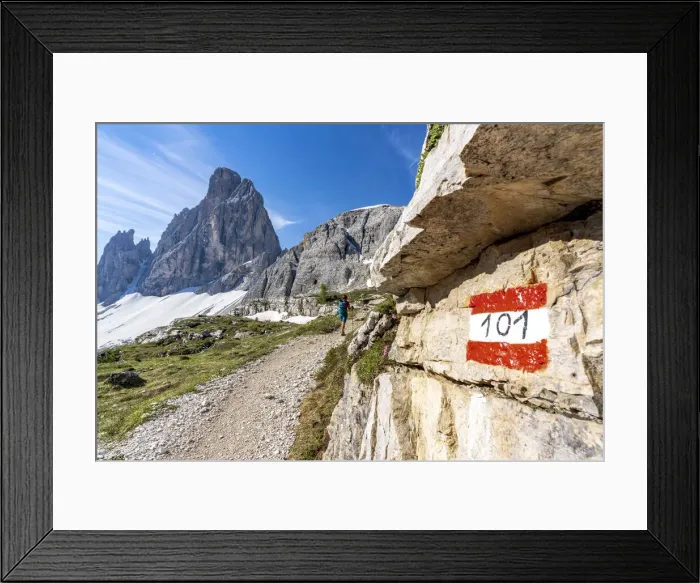 Framed Print : Rear view of hiker woman walking on path to majestic Croda Dei Toni mountain Framed Print : Rear view of hiker woman walking on path to majestic Croda Dei Toni mountain