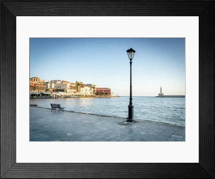 Framed Print : Old lantern in the Venetian harbour of Chania with lighthouse in background, Crete Framed Print : Old lantern in the Venetian harbour of Chania with lighthouse in background, Crete
