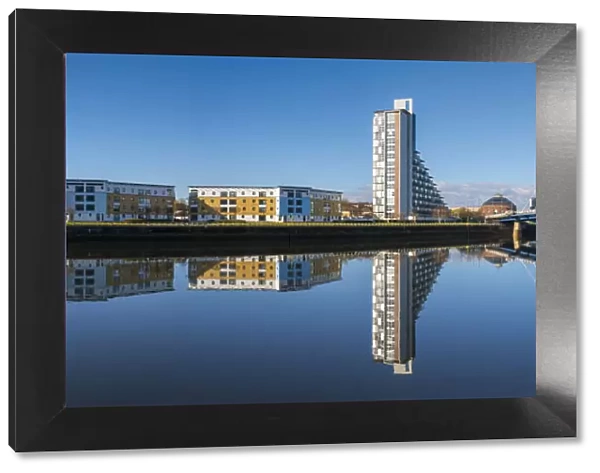 Panoramic reflection of Clyde Arc (Squinty Bridge) and flats, River Clyde, Glasgow