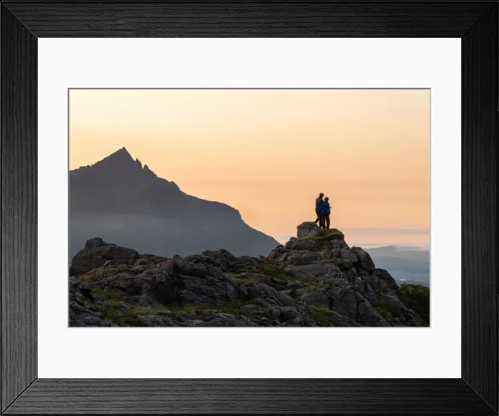 Framed Print : A couple standing on a rocky peak watching a mountain sunset with Sgurr nan Gillean in Framed Print : A couple standing on a rocky peak watching a mountain sunset with Sgurr nan Gillean in