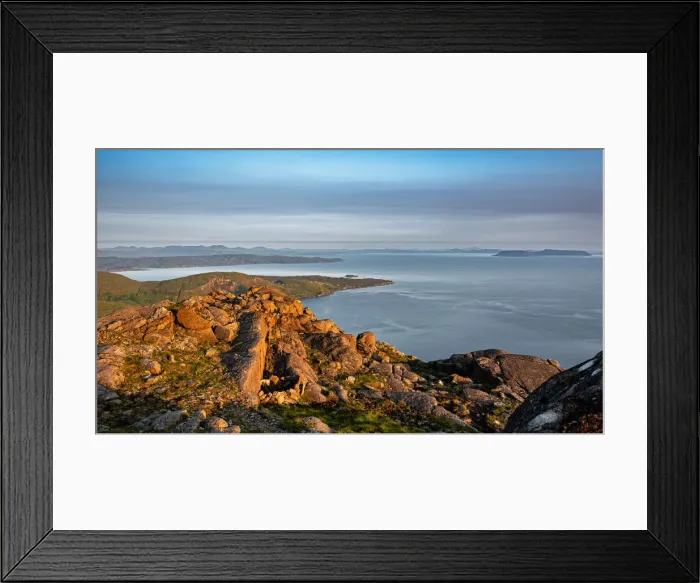Framed Print : Looking down on the village of Elgol and the Isle of Eigg from the summit of Sgurr na