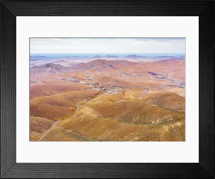 Framed Print : Winding road in the desert landscape from Mirador del Risco de las Penas viewpoint Framed Print : Winding road in the desert landscape from Mirador del Risco de las Penas viewpoint