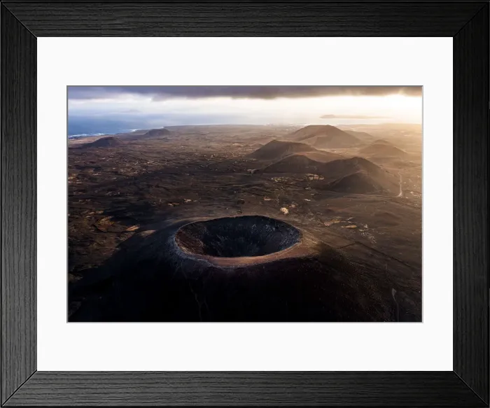 Framed Print : Aerial view of volcanoes and craters with the Atlantic Ocean in the background, Corralejo Framed Print : Aerial view of volcanoes and craters with the Atlantic Ocean in the background, Corralejo