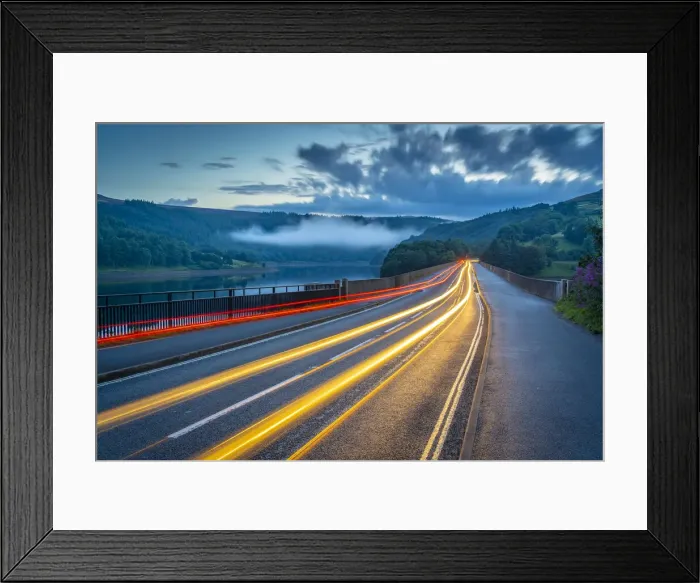 Framed Print : View of trail lights on Ladybower Reservoir bridge at dusk, Peak District National Park Framed Print : View of trail lights on Ladybower Reservoir bridge at dusk, Peak District National Park