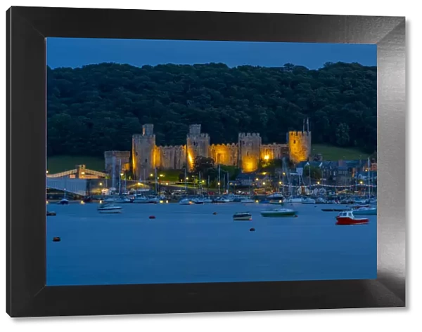 View of Conwy Castle, UNESCO World Heritage Site, and Conwy River at dusk, Conwy, Gwynedd