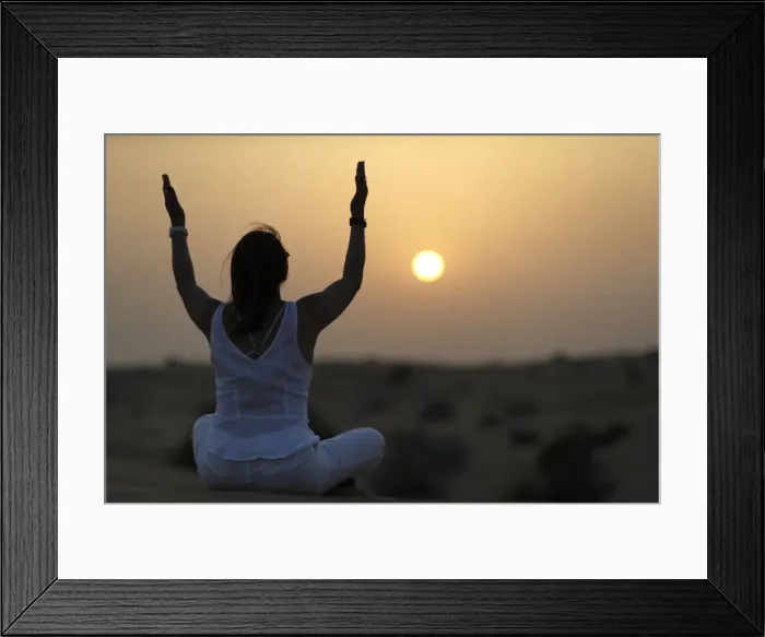 Framed Print : Sunset meditation in the desert at sunset, as concept for religion, faith Framed Print : Sunset meditation in the desert at sunset, as concept for religion, faith