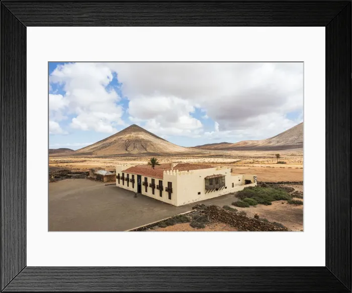 Framed Print : Casa de los Coroneles (House of Colonels) surrounded by volcanic mountains, La Oliva Framed Print : Casa de los Coroneles (House of Colonels) surrounded by volcanic mountains, La Oliva