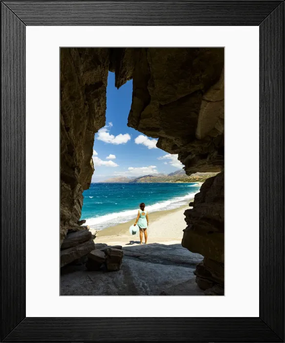 Framed Print : Rear view of young woman admiring the crystal sea from natural cave on Triopetra beach Framed Print : Rear view of young woman admiring the crystal sea from natural cave on Triopetra beach