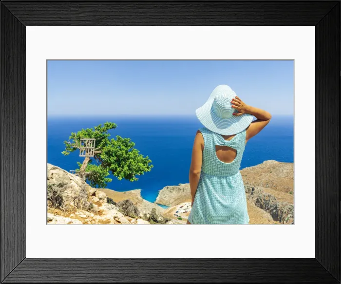 Framed Print : Back view of young woman with dress and sun hat watching the sea, Crete, Greek Islands Framed Print : Back view of young woman with dress and sun hat watching the sea, Crete, Greek Islands