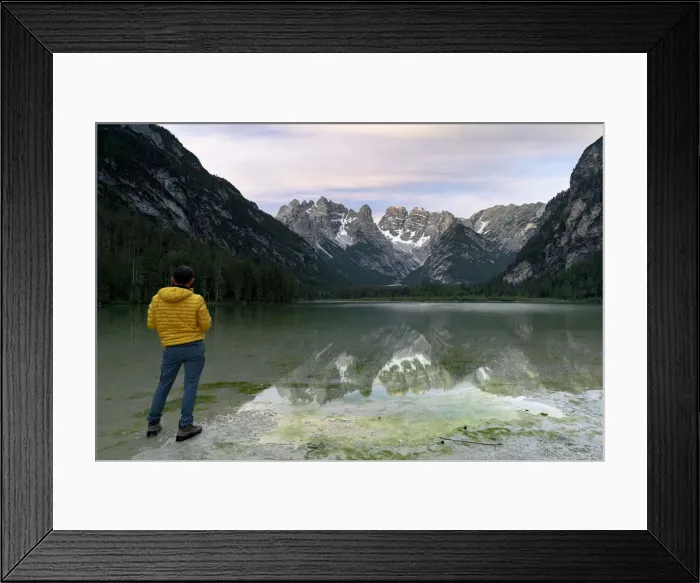 Framed Print : Rear view of hiker man admiring Monte Cristallo reflected in lake Landro (Durrensee Framed Print : Rear view of hiker man admiring Monte Cristallo reflected in lake Landro (Durrensee