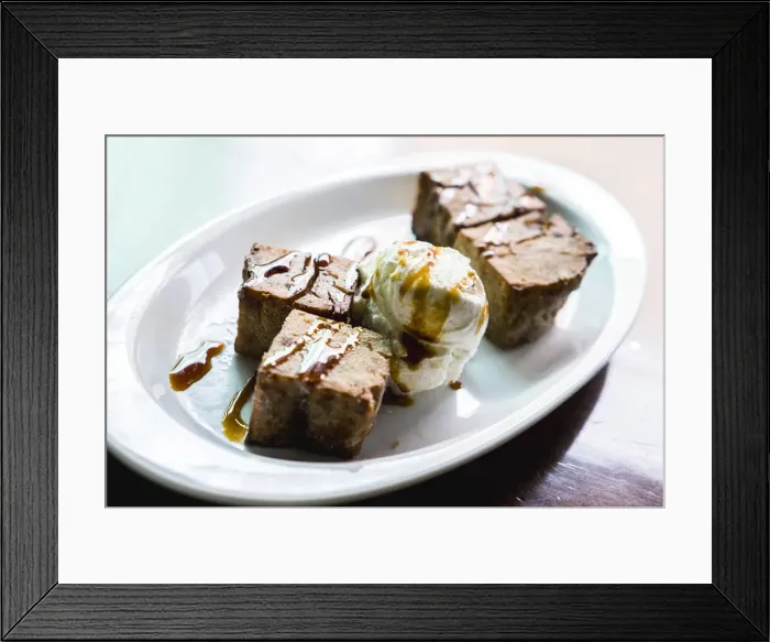 Framed Print : Fried Gofio, flour of roasted and ground cereal, in shape of brownies with ice cream Framed Print : Fried Gofio, flour of roasted and ground cereal, in shape of brownies with ice cream