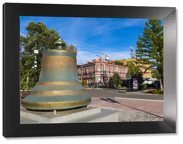 Old bell in front of Historic buildings, Minusinsk, Krasnoyarsk Krai, Russia, Eurasia