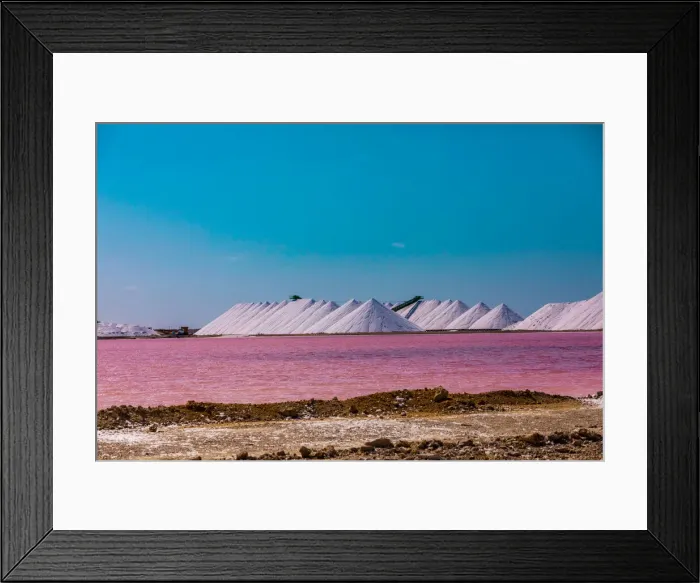 Framed Print : View of the pink colored ocean overlooking the Salt Pyramids of Bonaire from afar Framed Print : View of the pink colored ocean overlooking the Salt Pyramids of Bonaire from afar