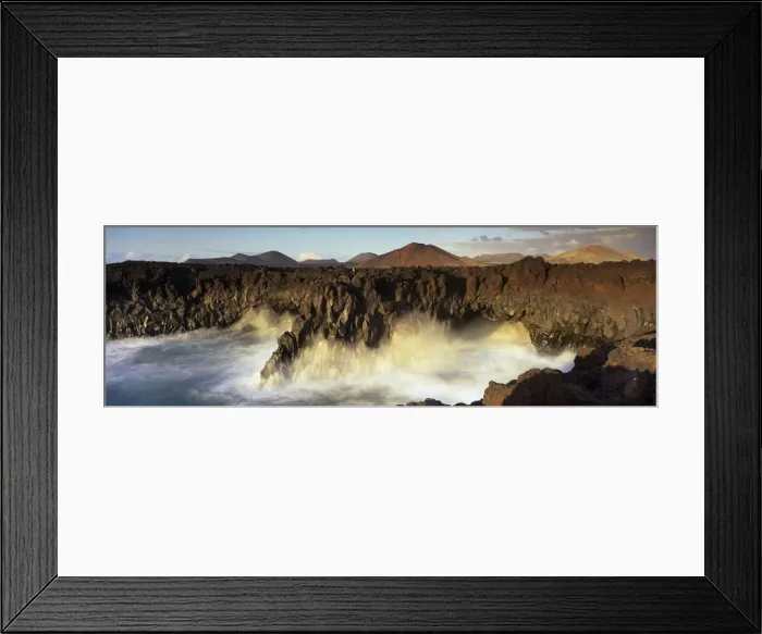 Framed Print : Volcanic coastline with waves crashing into sea caves, Los Hervideros Framed Print : Volcanic coastline with waves crashing into sea caves, Los Hervideros