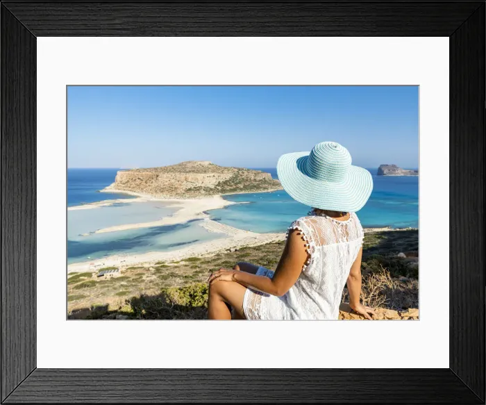 Framed Print : Portrait of woman with hat admiring the idyllic beach and lagoon sitting on top of hill Framed Print : Portrait of woman with hat admiring the idyllic beach and lagoon sitting on top of hill