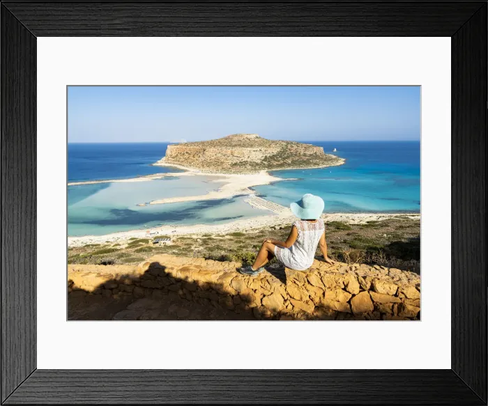 Framed Print : Charming woman with sundress and hat contemplating the crystal turquoise sea and lagoon Framed Print : Charming woman with sundress and hat contemplating the crystal turquoise sea and lagoon