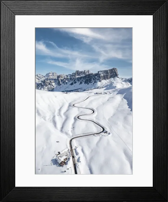 Framed Print : Aerial view of winding mountain road in the snow and Lastoi De Formin, Giau Pass Framed Print : Aerial view of winding mountain road in the snow and Lastoi De Formin, Giau Pass