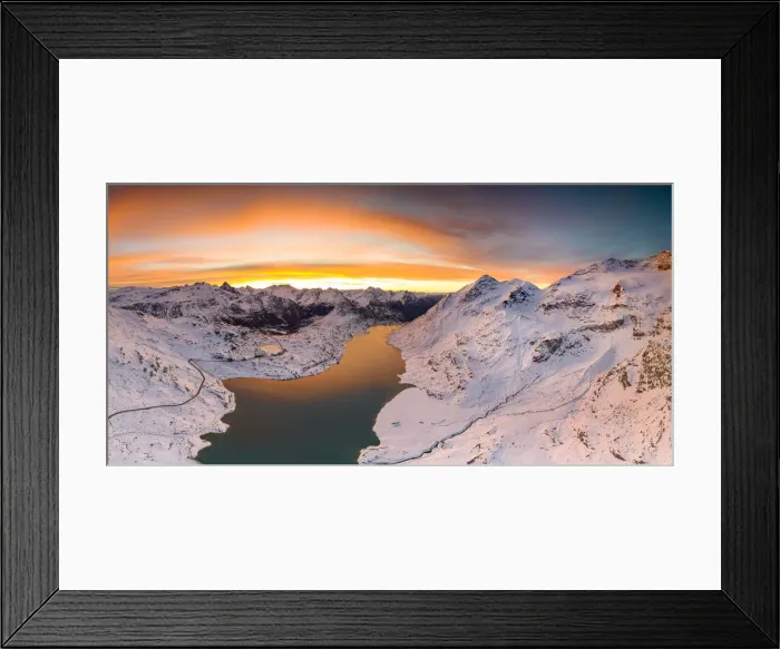 Framed Print : Aerial view of Lago Bianco and Bernina Pass road crossing the snowcapped mountains Framed Print : Aerial view of Lago Bianco and Bernina Pass road crossing the snowcapped mountains