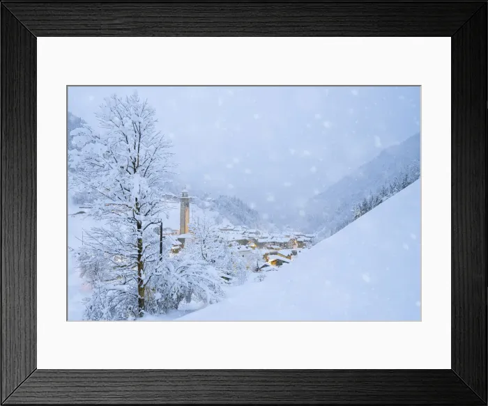Framed Print : Snowflakes falling on mountain huts in the fairy tale alpine village at Christmas time Framed Print : Snowflakes falling on mountain huts in the fairy tale alpine village at Christmas time